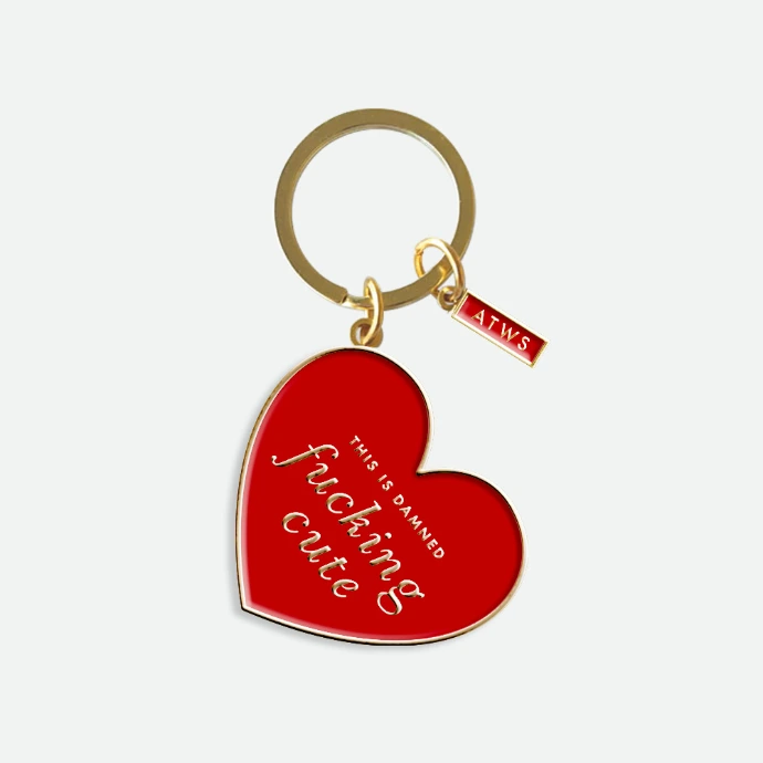 Porte-clés en cœur rouge, avec l'inscription "Fucking cute". (porte-clés en émail)